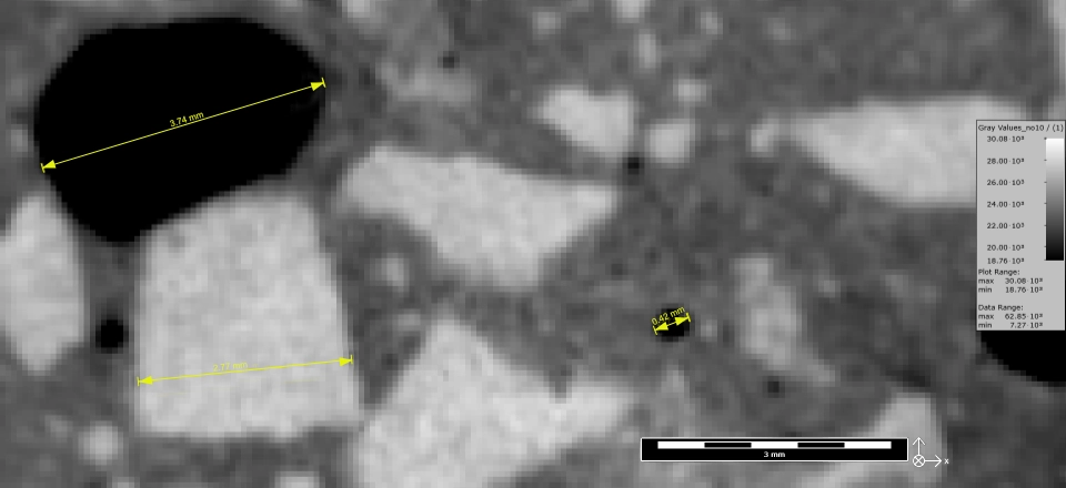 Beispiel, in dem charakteristische Merkmale der Betonprobe gemessen und kommentiert werden.